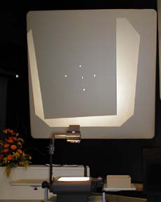 colliding ball bearings burn holes into a seet of paper.