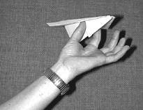 a paper plane ready for launch