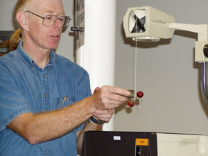 Paul Doherty pushes a grape with a magnet